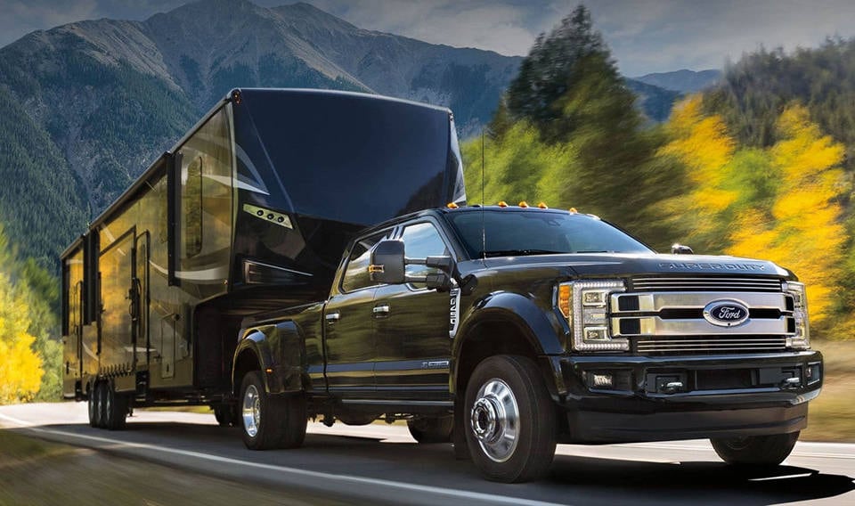 A 2018 Ford F-250 towing a horse trailer