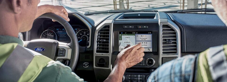 Construction Workers using their Ford SYNC System
