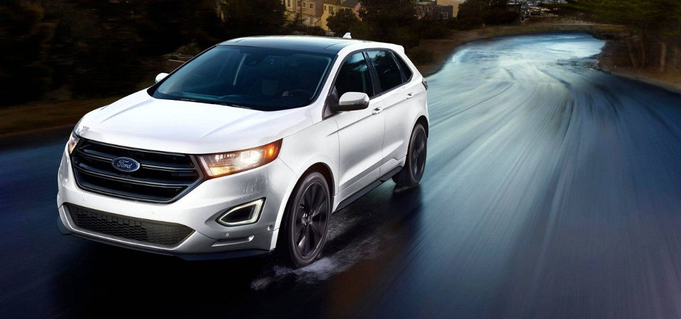 2017 Ford Edge driving at the viewer fast