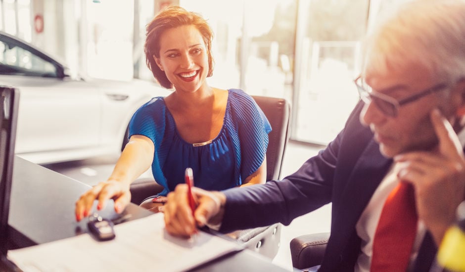 A dealer selling a used car to a customer