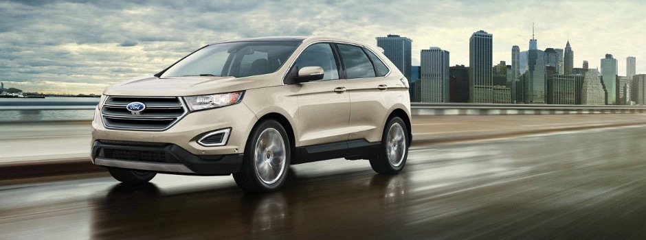 2017 Ford Edge driving on a cloudy day