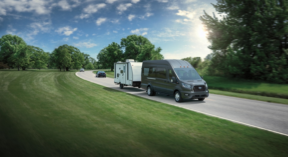 Ford Transit van towing a trailer