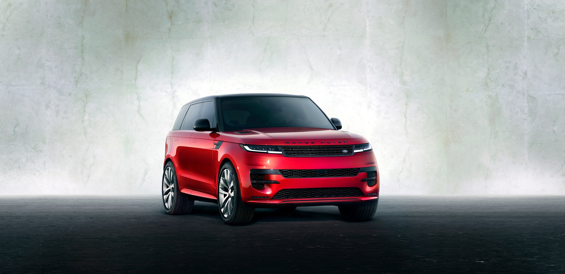  Red Range Rover Sport in driveway