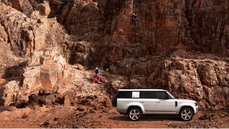 2023 Land Rover Defender Exterior Parked By Mountain Climbers