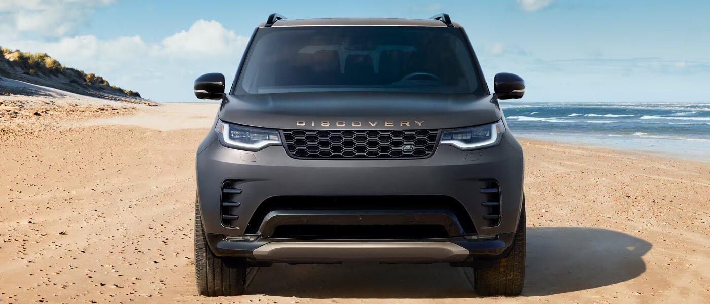 2026 Land Rover Discovery parked head on at beach