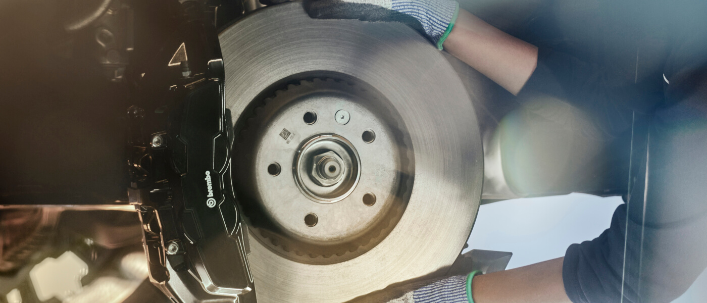 Technician checking brakes