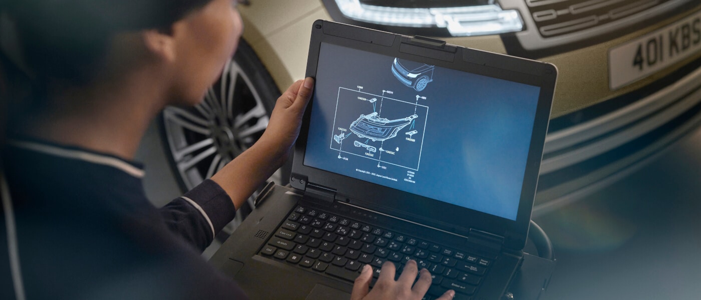 Technician checking computer