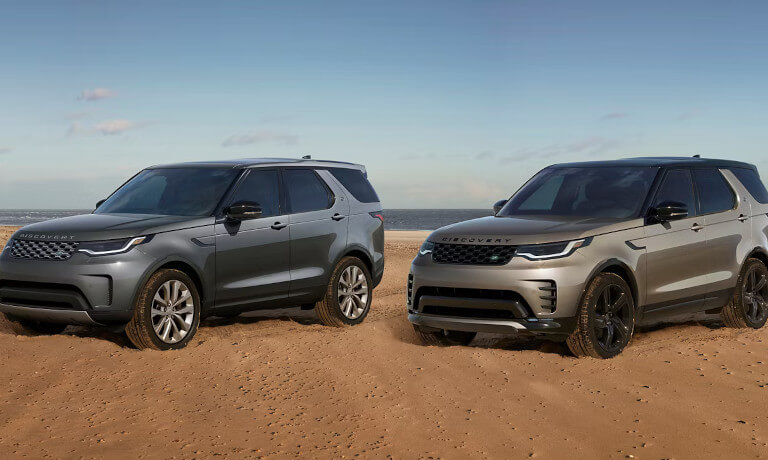 2026 Land Rover Discovery pair parked on the beach