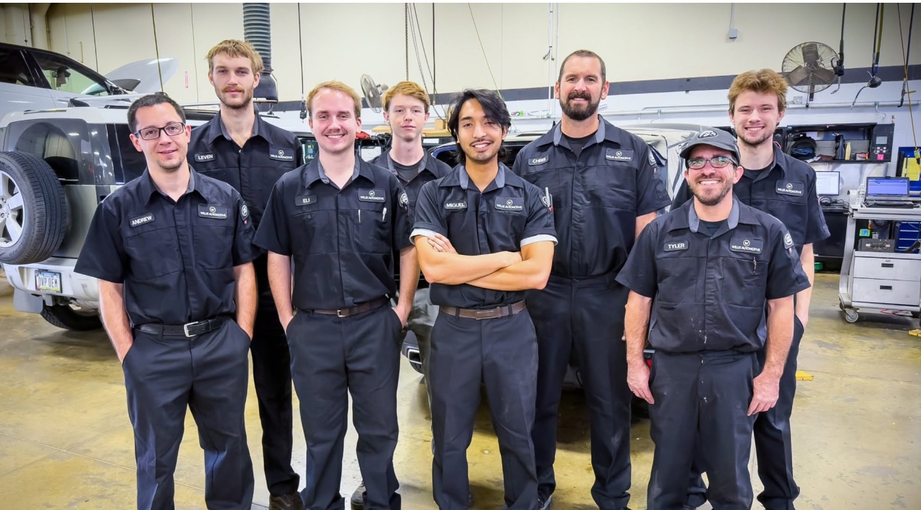 The Land Rover of Des Moines service center team lined up and smiling.