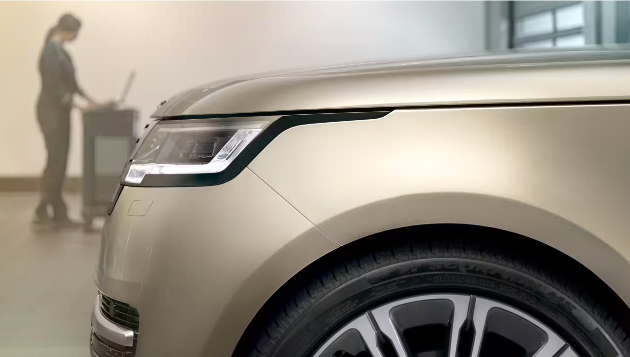 Car battery inspections at a Land Rover Glen Cove service center
