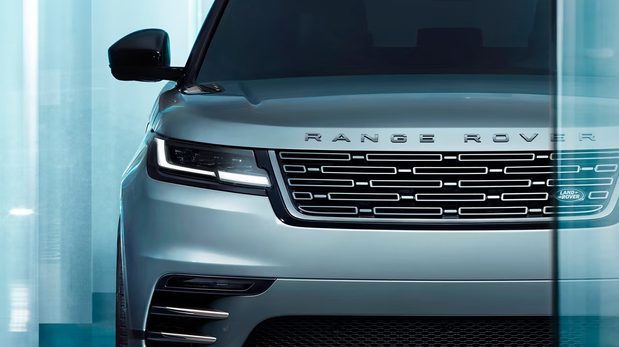 Close-up view of the Range Rover Velar front grille, headlights and hood