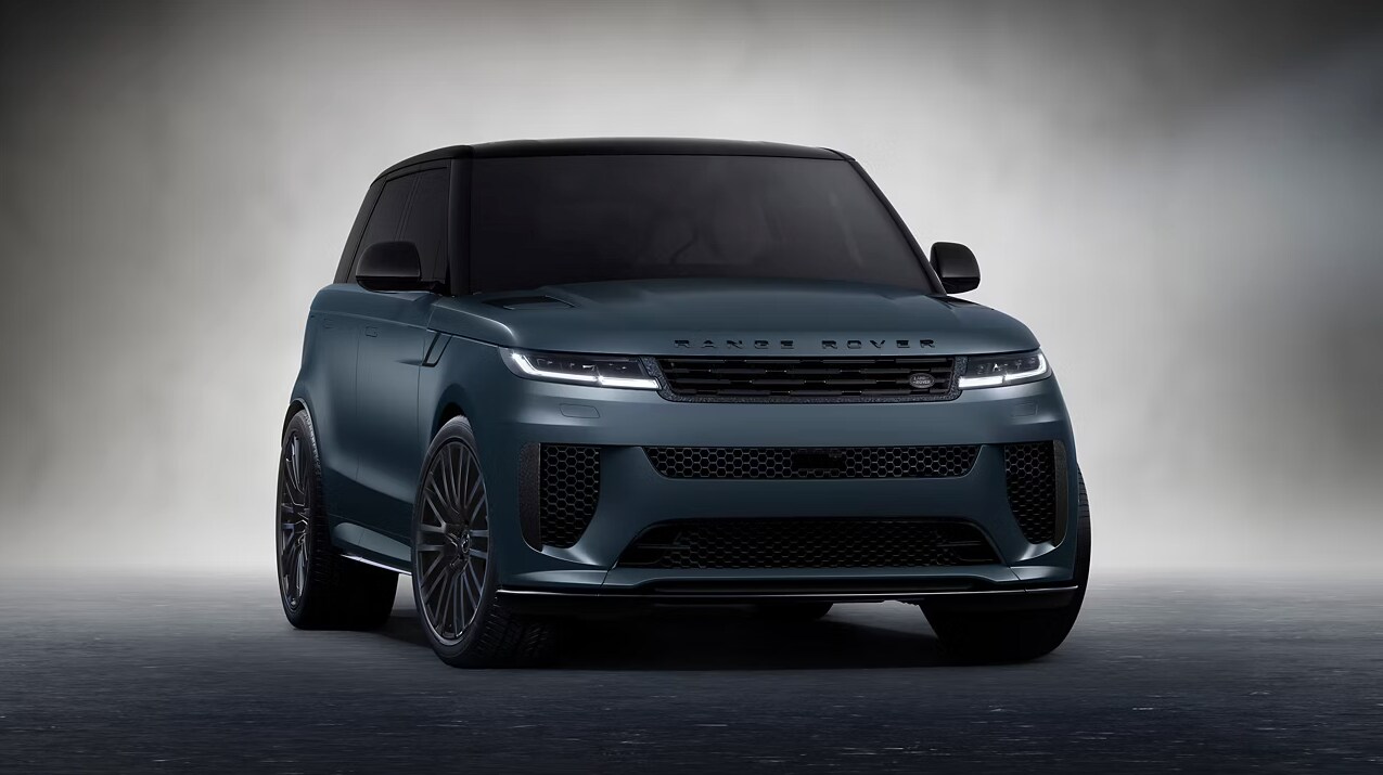 Front view of the 2025 Range Rover Sport with its headlights turned on