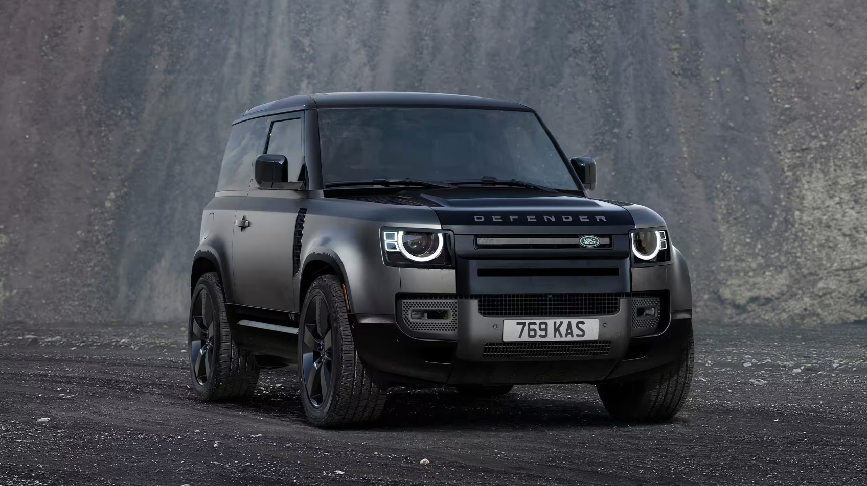 Front view of the 2024 Defender 110 V8 Carpathian Edition on a dirt road