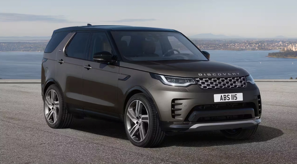2024 Discovery Metropolitan with a body of water and city in the background