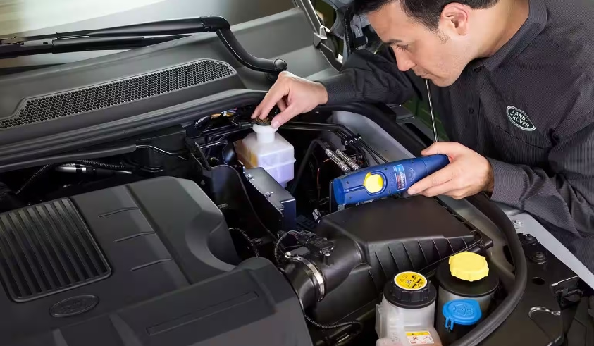 Land Rover Maintenance technician working on vehicle