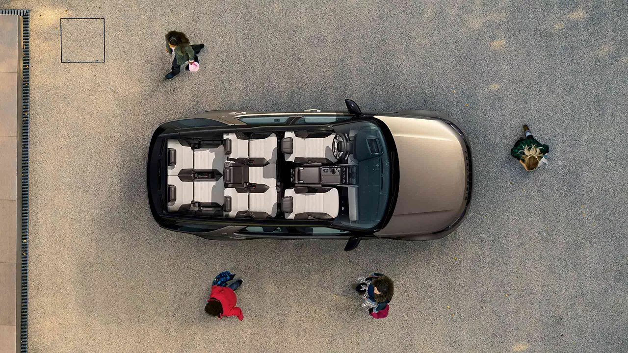 Overhead interior view of the 2026 Discovery with people in the background