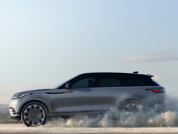  Person cheerfully signing documents.