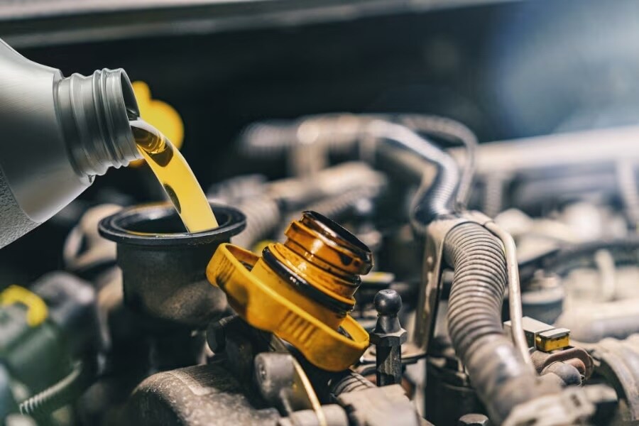 Technician performing Land Rover oil change