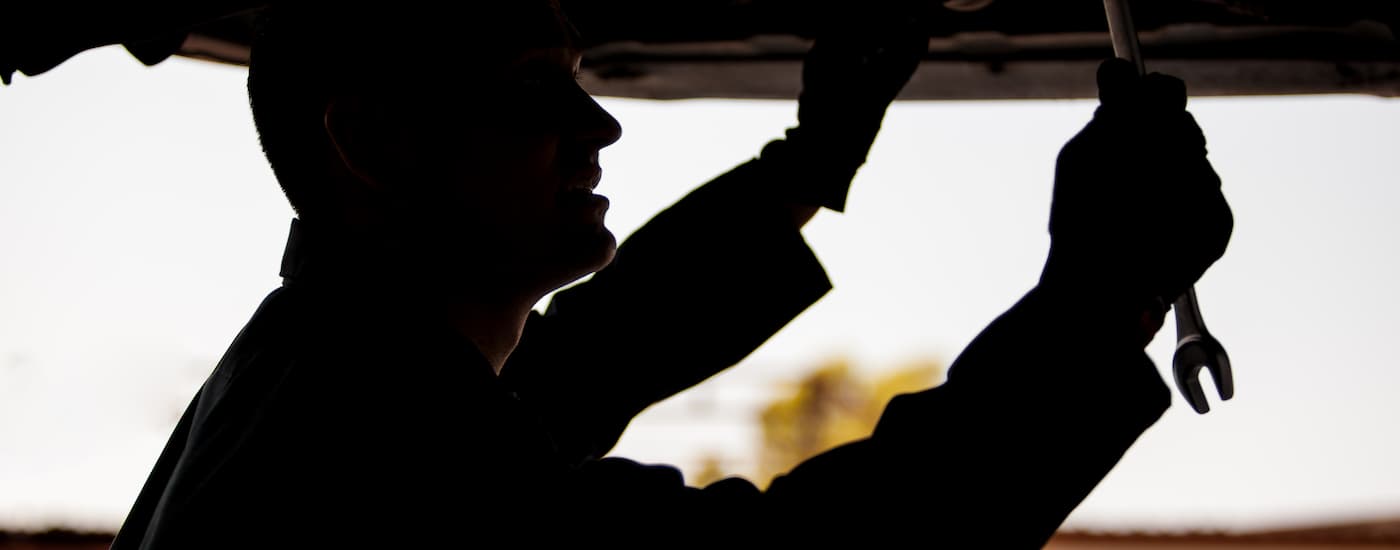 Mechanic changing the oil on a vehicle