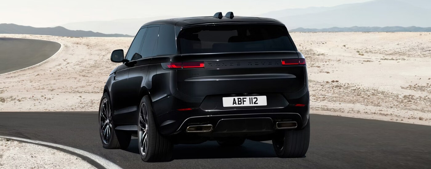 Black 2026 Range Rover Sport driving along a track