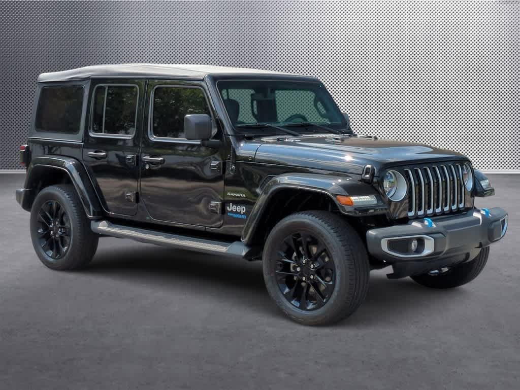 Used 2022 Jeep Wrangler Unlimited Sahara 4XE with VIN 1C4JJXP6XNW161139 for sale in Orlando, FL