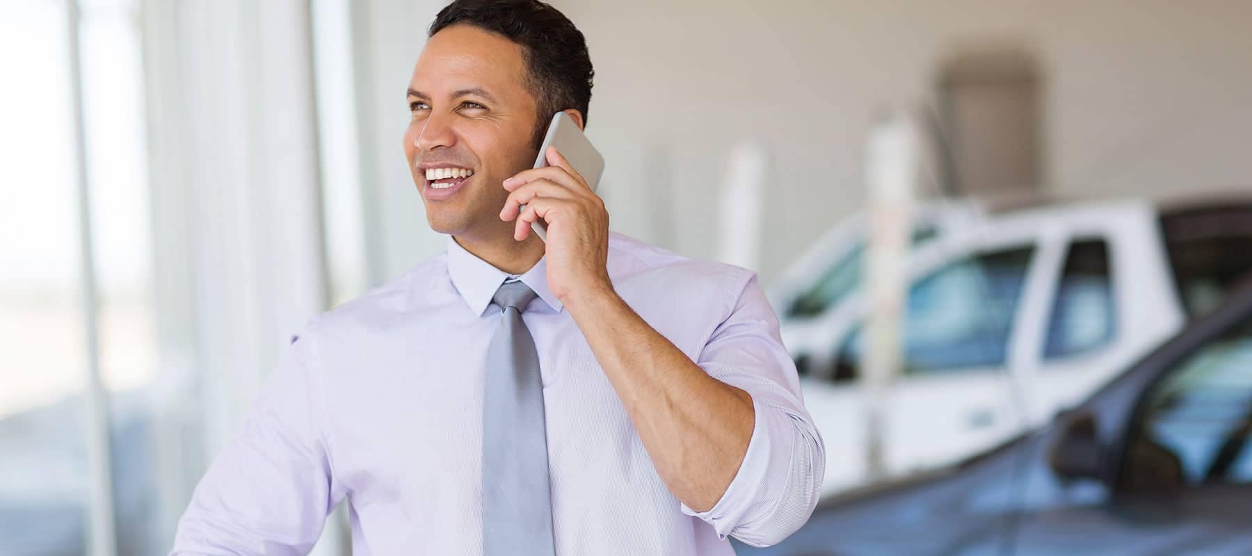 a man on mobile phone in showroom