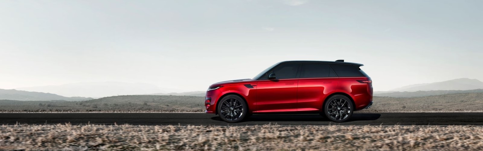 side view of a Range Rover SUV on a stylized background