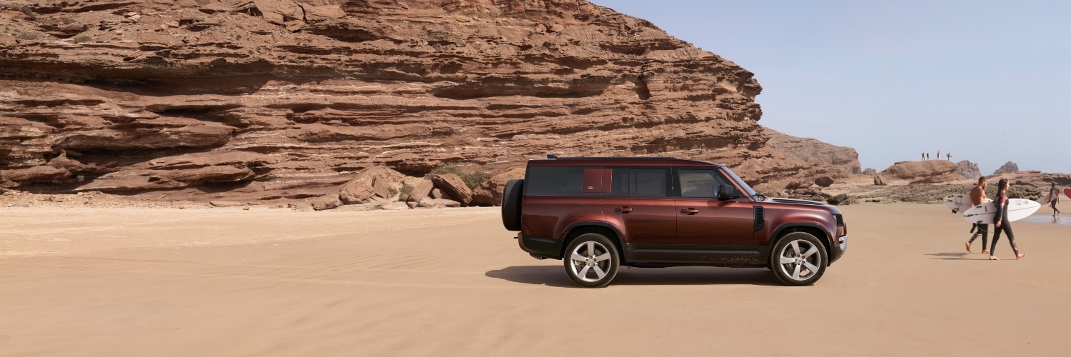 Defender 110 sideview in desert setting
