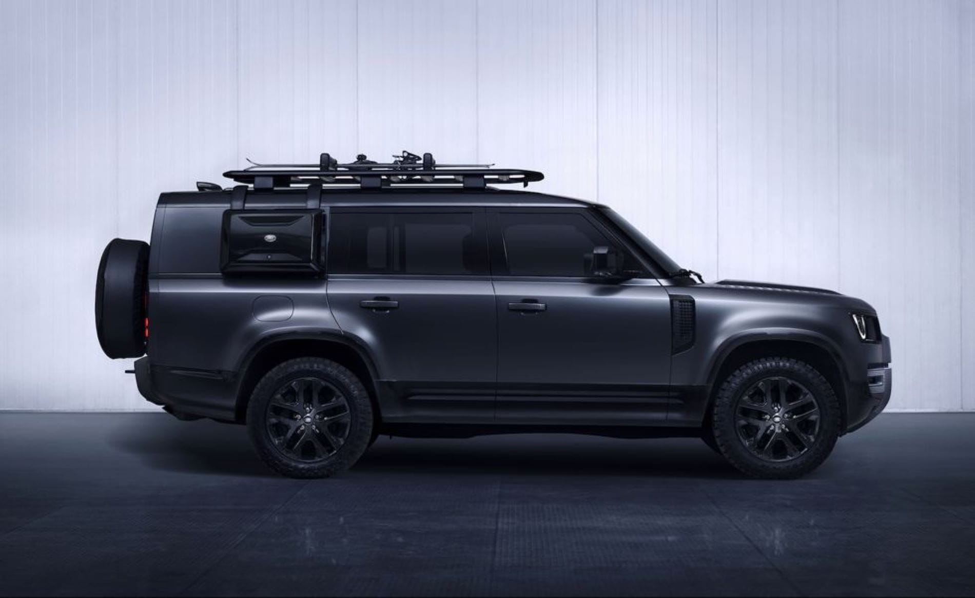 Exterior of Land Rover Defender L663 with four doors and alloy wheels