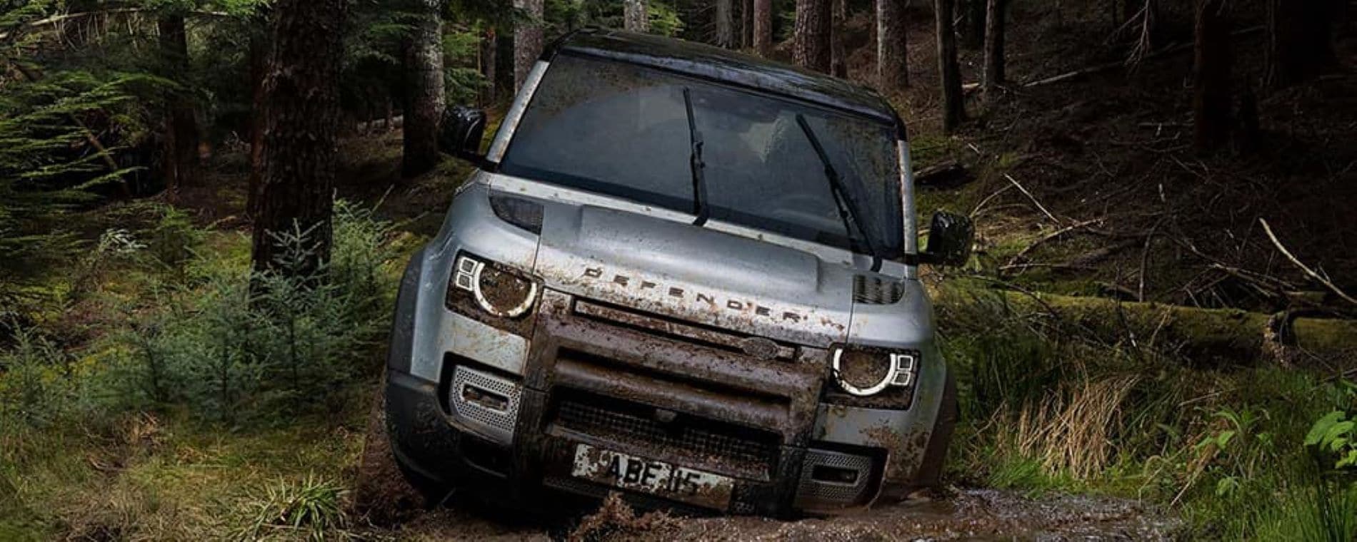 Interior of Land Rover Defender with four doors, third row seats and digital gauge cluster