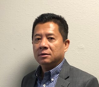 Staff member Siden Chhour from ID_a89297