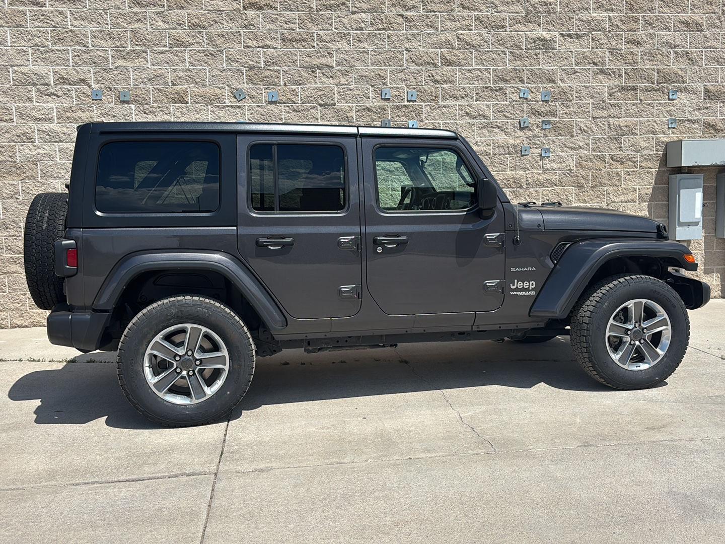 Used 2021 Jeep Wrangler Unlimited Sahara with VIN 1C4HJXEMXMW815636 for sale in Wheatland, WY