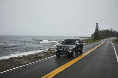 jeep grand cherokee overland driving on the road