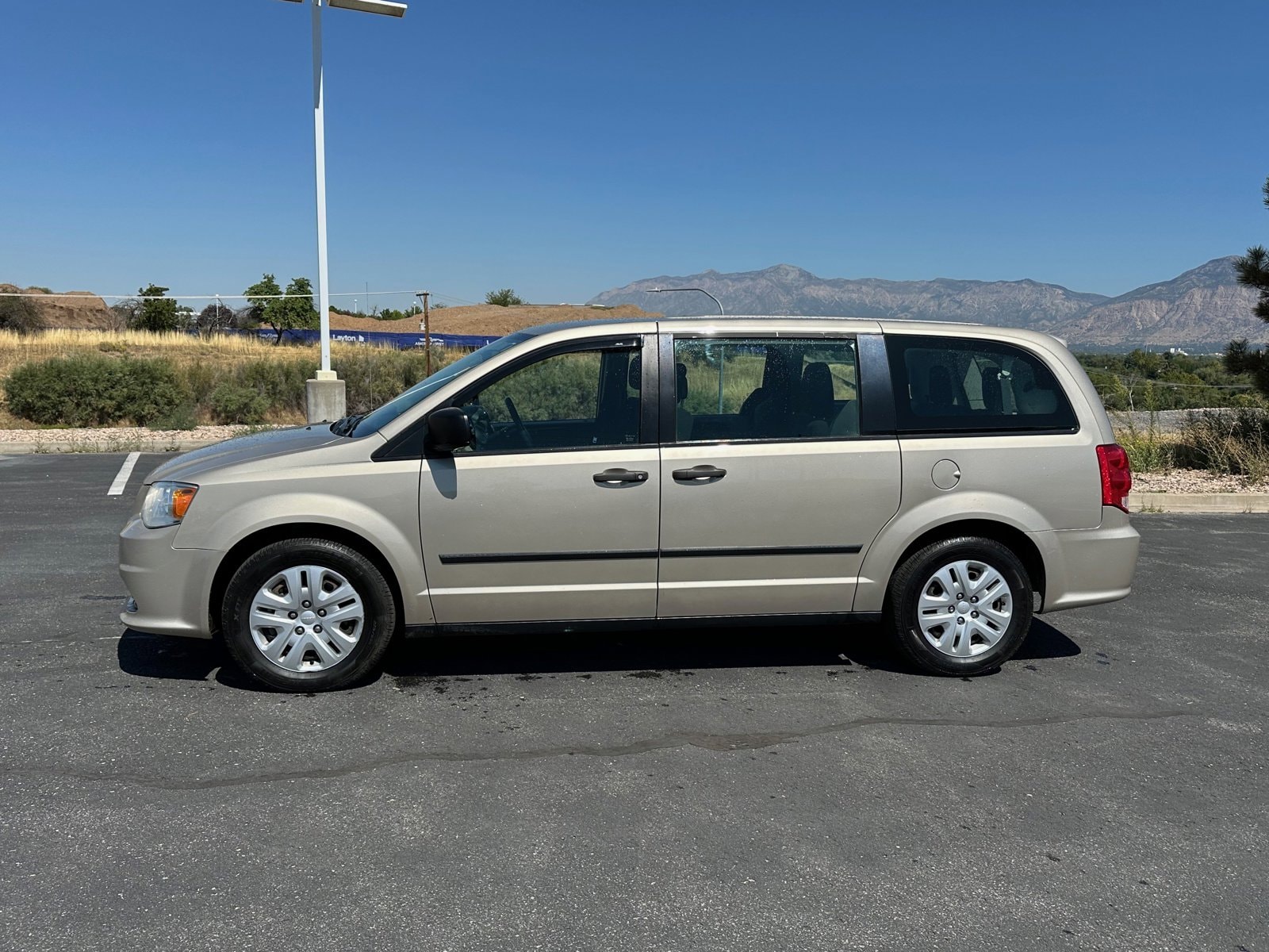 Used 2015 Dodge Grand Caravan American Value Package with VIN 2C4RDGBGXFR635403 for sale in Riverdale, UT