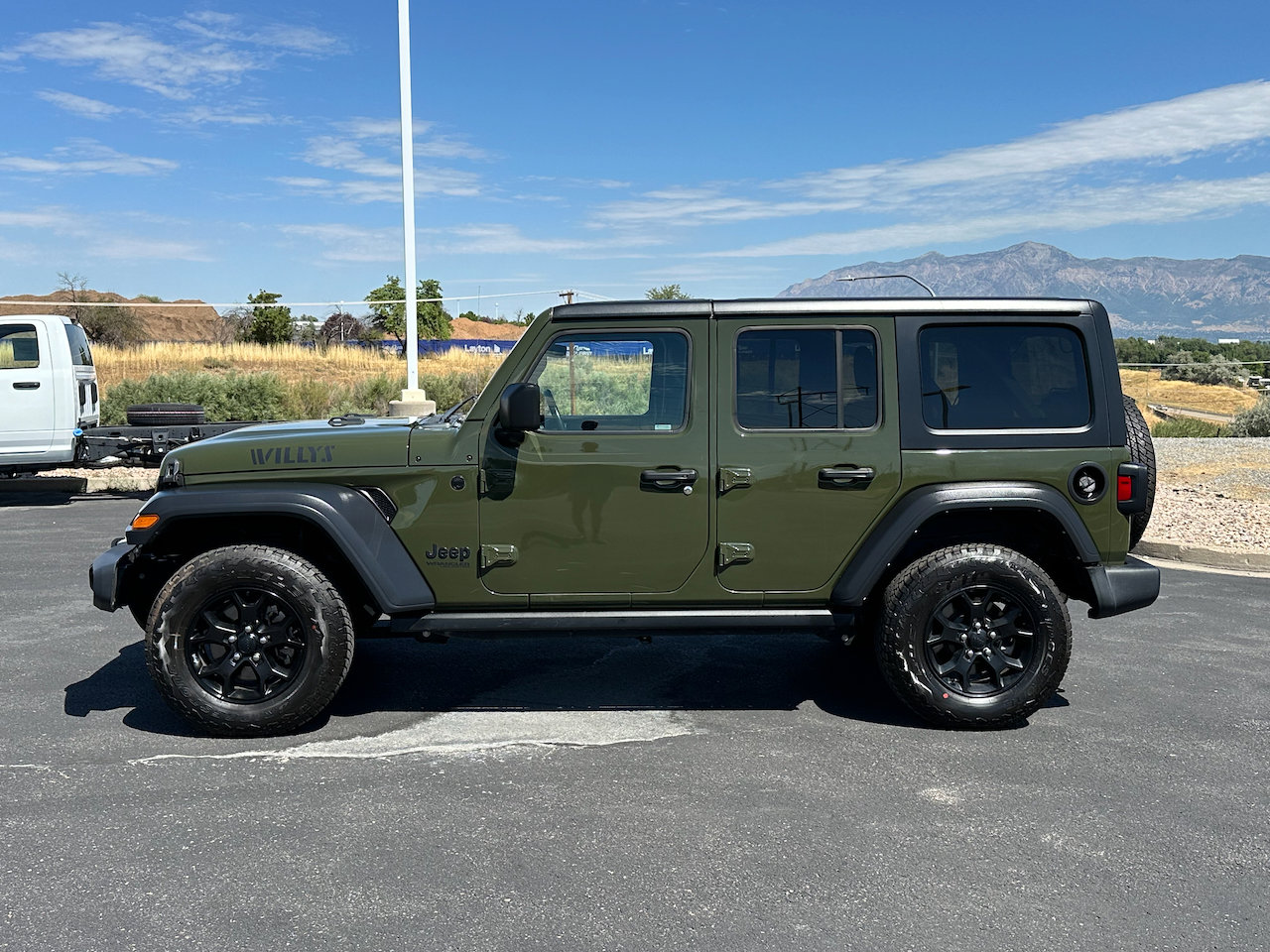 Used 2022 Jeep Wrangler Unlimited Willys with VIN 1C4HJXDG7NW122116 for sale in Riverdale, UT