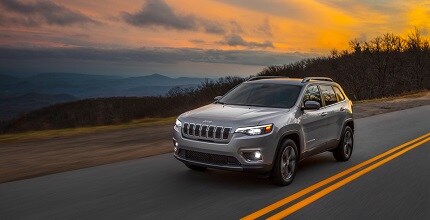 Jeep Cherokee driving on the road