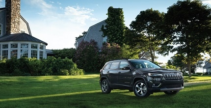 Jeep Cherokee on front lawn