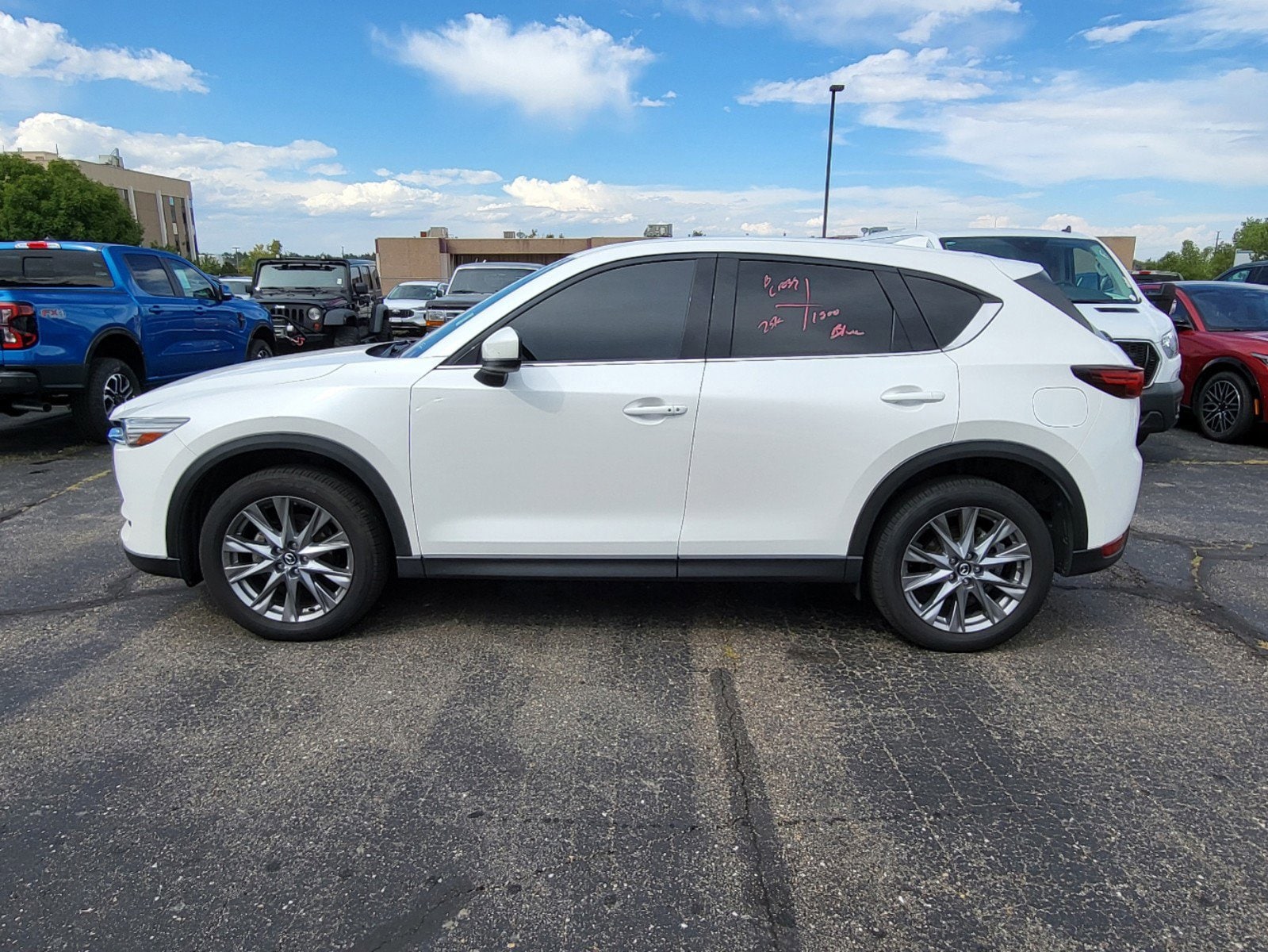 Used 2021 Mazda CX-5 Grand Touring with VIN JM3KFBDM4M1460849 for sale in Lakewood, CO