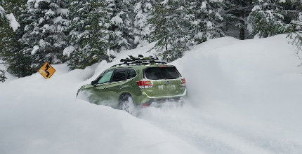 Subaru Forester driving in deep snow
