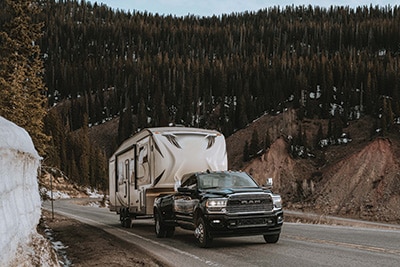 Ram 3500 exterior with trailer Ram 3500 hauling a trailer on mountain roads