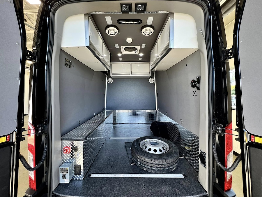 Custom Ford Transit cargo van interior with bins and shelving upfit by Lasco Ford Fenton Michigan
