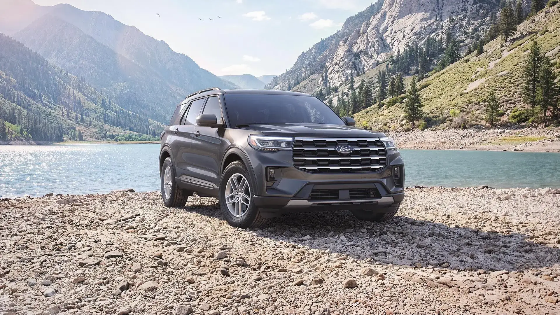 2027 Ford Explorer on a rocky lakeshore, available at Lasco Ford in Fenton Michigan