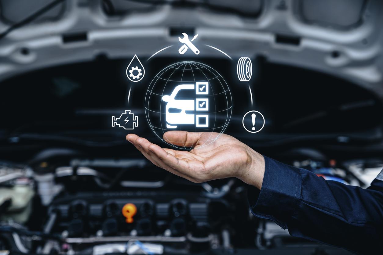 A hand showing different aspects of car maintenance.