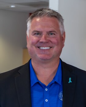 Staff member John Broome from ID_4e8e8147f846