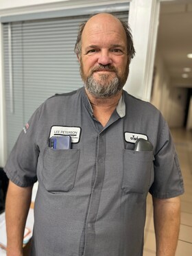 Staff member JOHN LANGE from 751740f90779