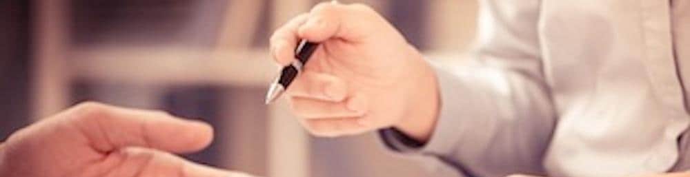 A person holding a pen