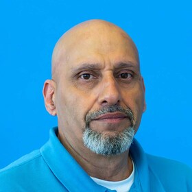 Staff member Mike Mustafa from ID_191f0c31d460