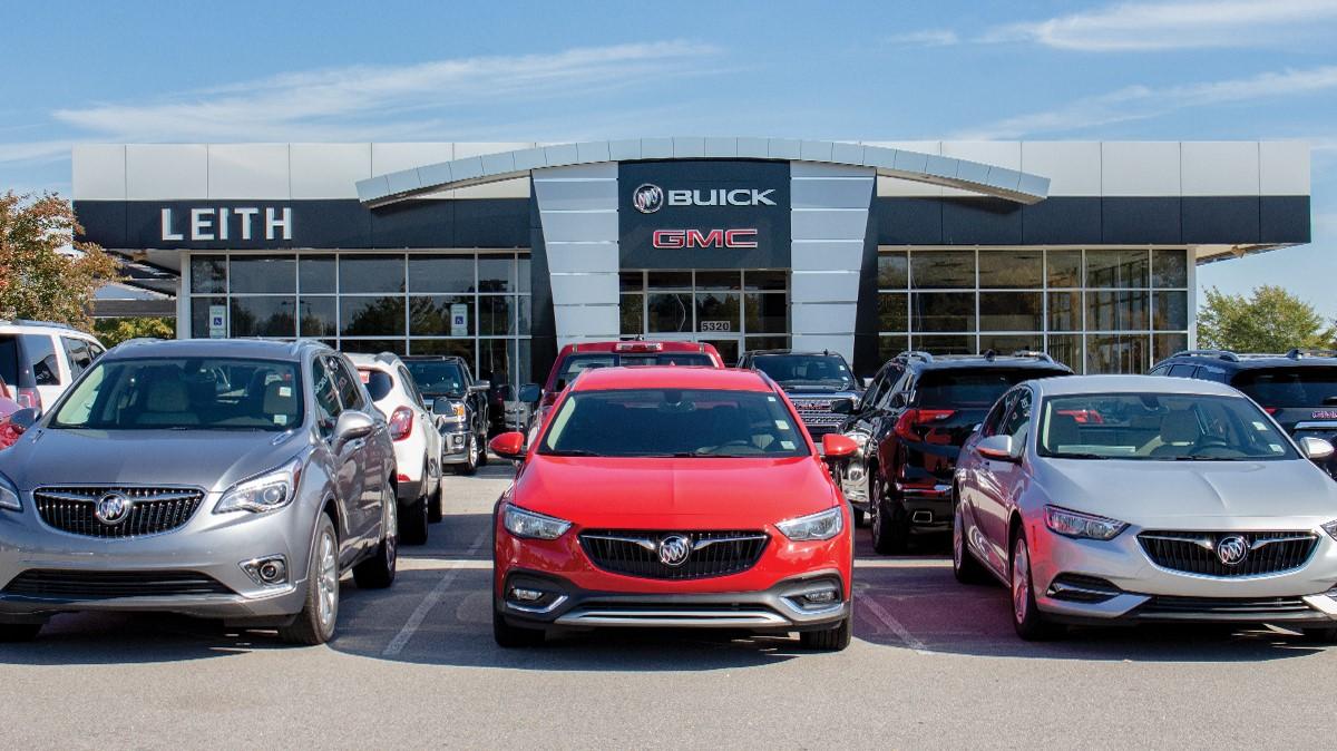 Smiling Women at dealership on phone