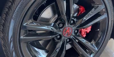 Black wheels and red brake calipers by RIMGUARD