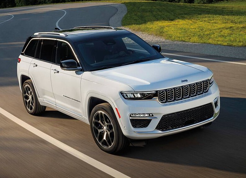 2025 Jeep Grand Cherokee pictured driving on flat road